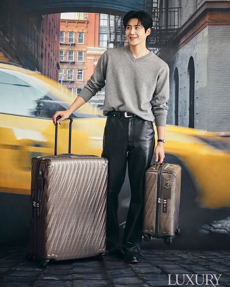 Premium hardside suitcase standing in an airport terminal